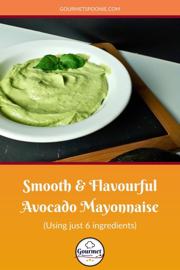 A white bowl of smooth, flavourful avocado mayonnaise, garnished with herbs, sits on a dark tray. Text below reads, “Smooth and Flavourful Avocado Mayonnaise (Using just 6 ingredients).”.