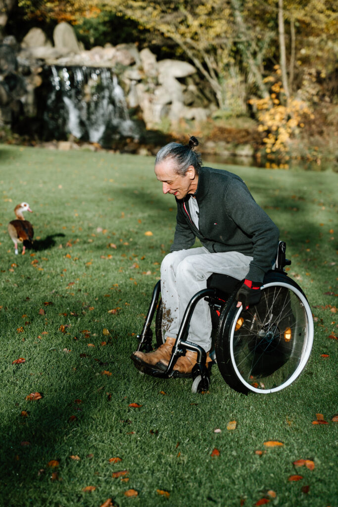 Image of Spoonie Chef Daan Katz, in wheelchair on grass