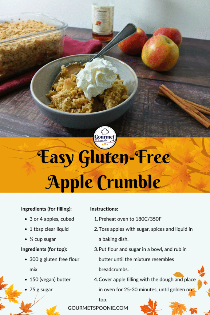 A bowl of gluten-free apple crumble sits on a wooden table with apples and cinnamon sticks in the background. Beside it, a baking dish and serving spoon await. Try this easy gluten-free apple crumble recipe displayed for you.