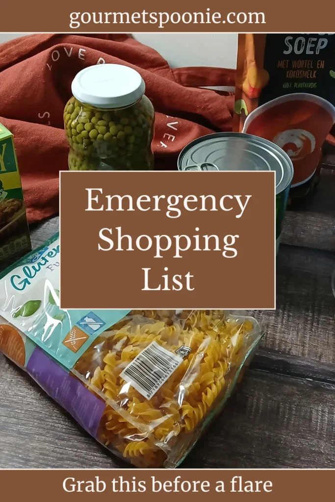 Spoonie pantry staples: granola bars, canned peas, pumpkin soup, breadsticks, canned tomatoes, pasta, and vegetable spread sit on a dark wooden surface.