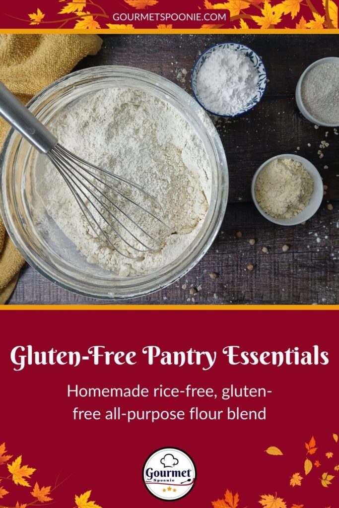 A large bowl of flour with a whisk sits on a wooden surface, surrounded by small bowls of flour and a yellow towel. Text below reads: “Gluten-Free Pantry Essentials: Homemade rice-free, gluten-free all-purpose flour blend.”.