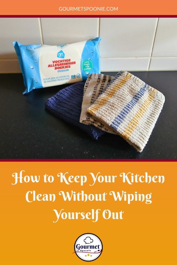 A pack of wet wipes and three folded dish cloths sit on a kitchen counter, above a banner that reads how to keep your kitchen clean without wiping yourself out.