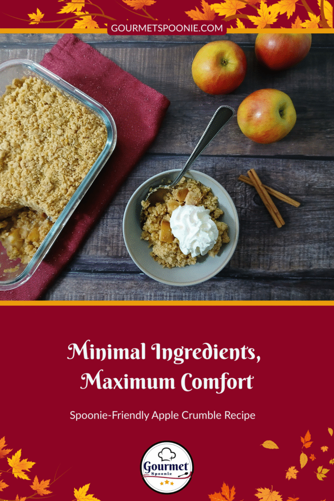 A dish of apple crumble with a serving in a bowl topped with whipped cream, a spoon, apples, and cinnamon sticks on a wooden table. Text reads: Minimal Ingredients, Maximum Comfort—Spoonie-Friendly apple crumble recipe.