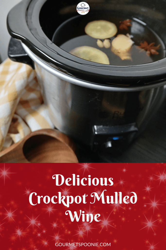 A slow cooker filled with gluhwein ingredients like lemon slices, star anise, and cinnamon sticks sits on a counter next to a wooden spoon and a yellow checkered towel. Text reads: Delicious Crockpot Mulled Wine.