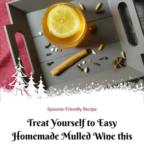 A glass of mulled wine with a lemon slice sits on a tray beside a cinnamon stick and spices, on a wooden surface with a red cloth. Text below reads, Treat Yourself to Easy Homemade Mulled Wine this Christmas!.