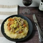 easy slow cooker polenta, served on a black plate