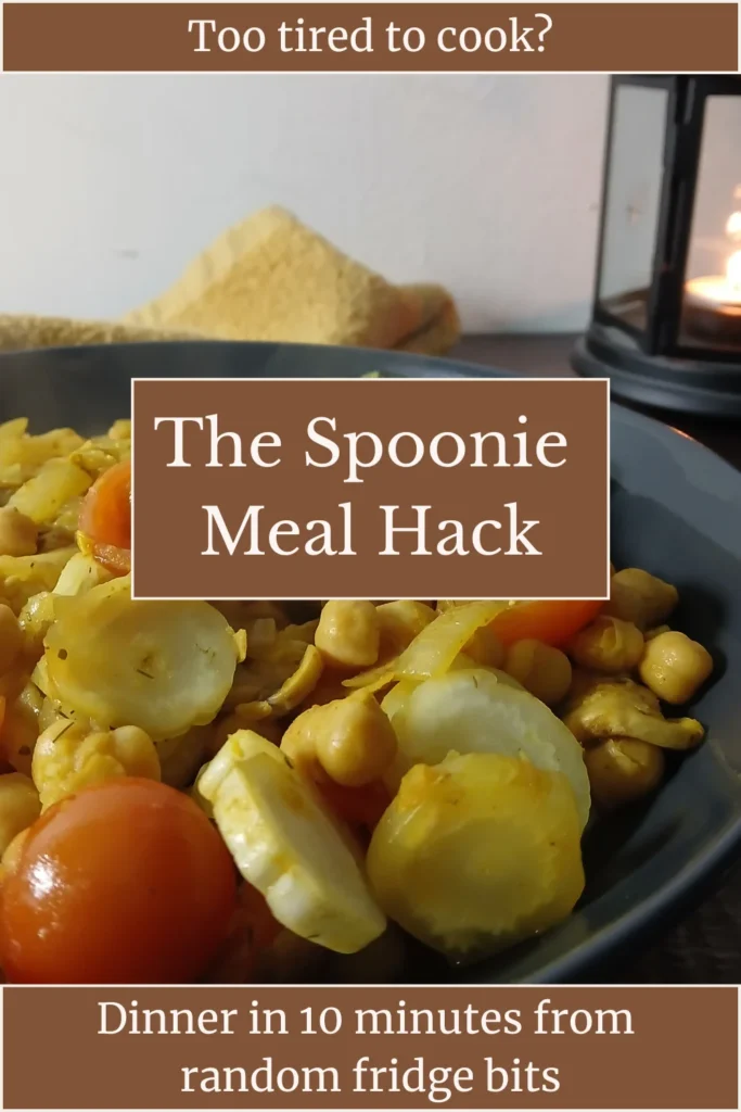 A bowl of cooked vegetables and chickpeas sits on a table with a lantern in the background. Text reads: Too tired to cook? The Spoonie Meal Hack. Dinner in 10 minutes from random fridge bits.