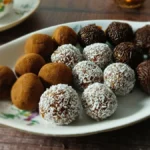 Healthy chocolate date energy bites served on a decorative tray.