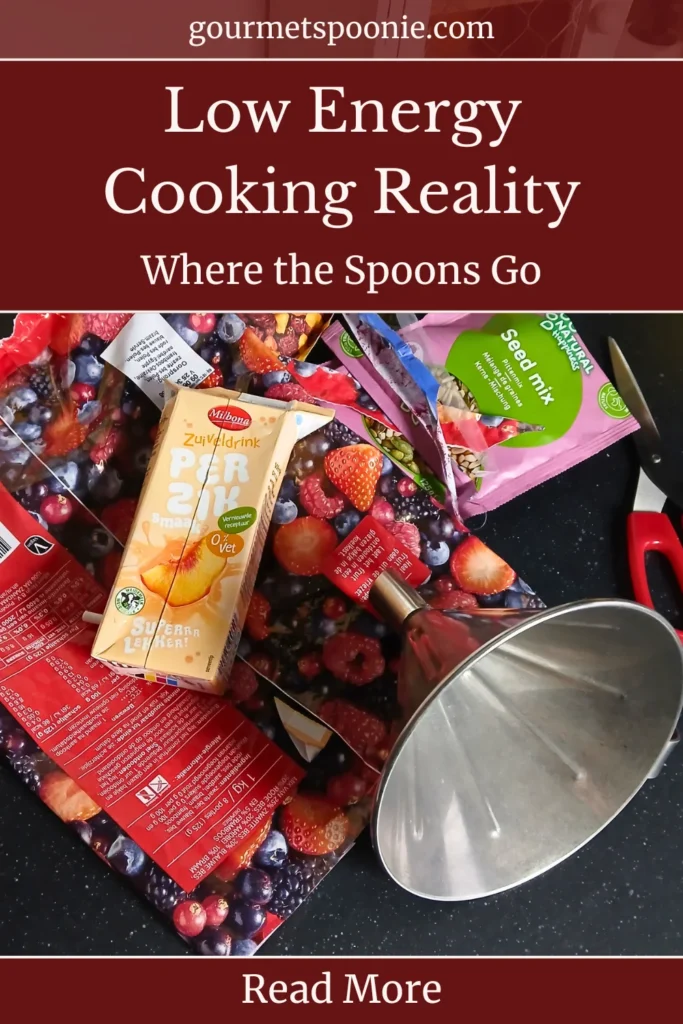 Kitchen after cooking with chronic illness showing used empty packaging, scissors, a funnel, and signs of fatigue after a recipe shoot