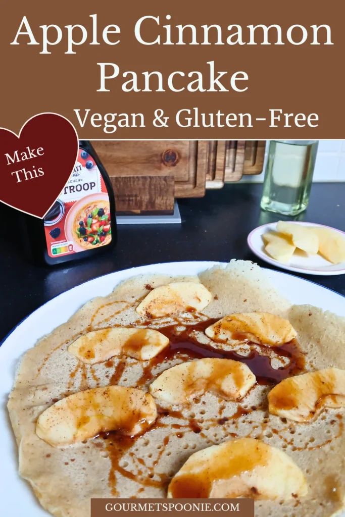 Gluten-free vegan Dutch pancake with apple slices and cinnamon, lightly browned
