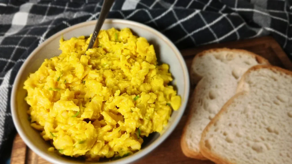 high-protein vegan egg salad in rustic bowl.