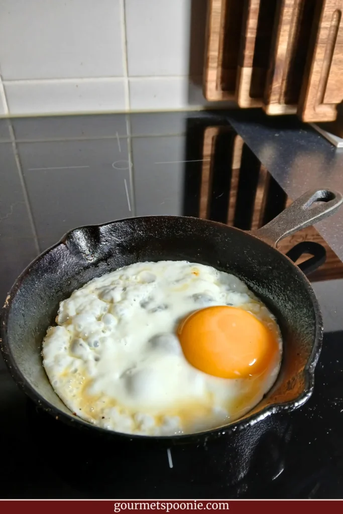 Small cast-iron frying pan used for accessible cooking in a chronic illness friendly kitchen.