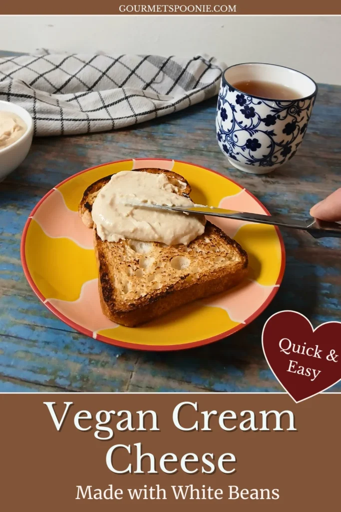 High-protein vegan cream cheese made with white beans being spread on toast with a knife