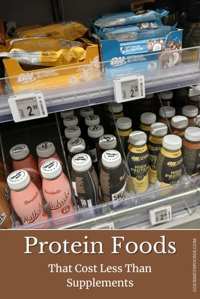 Protein shakes and protein snacks on supermarket shelves with multiple brands and flavours visible.