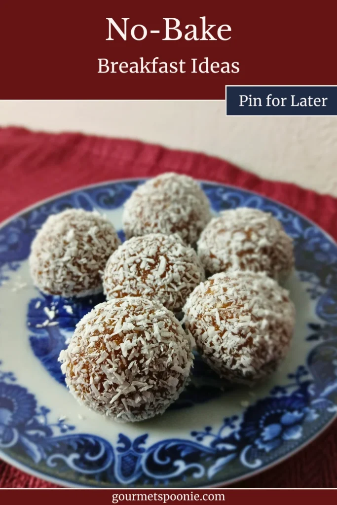 A plate of homemade date balls coated in desiccated coconut on a blue patterned plate. Perfect for make-ahead gluten-free breakfasts.