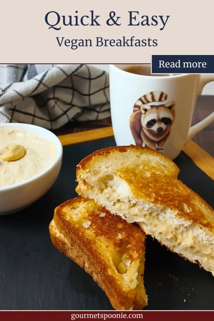 Two slices of gluten-free toast with vegan cream cheese served beside a bowl of hummus and a mug